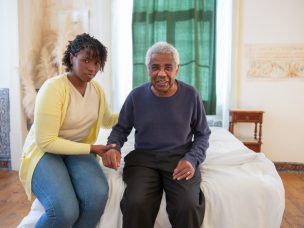 an elderly man and her caregiver